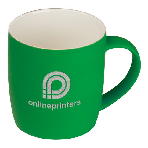 Grne Keramiktasse mit abgerundeten Kanten und Henkel.